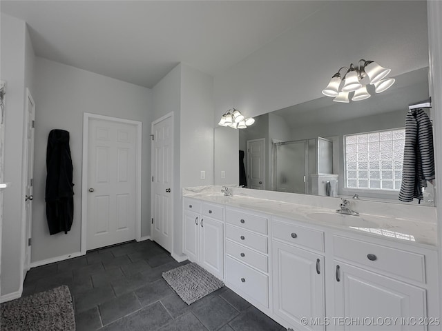 bathroom with vanity and a shower with shower door