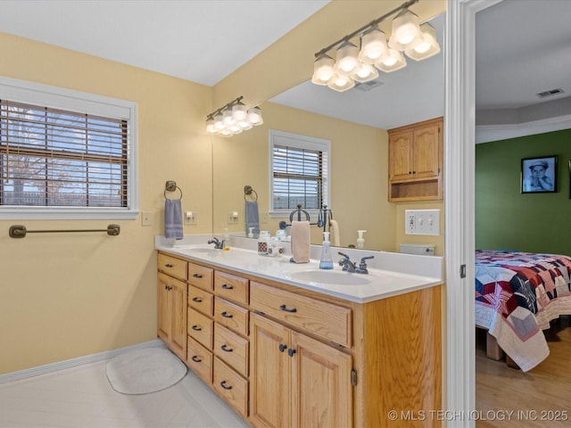 bathroom featuring tile patterned floors and vanity