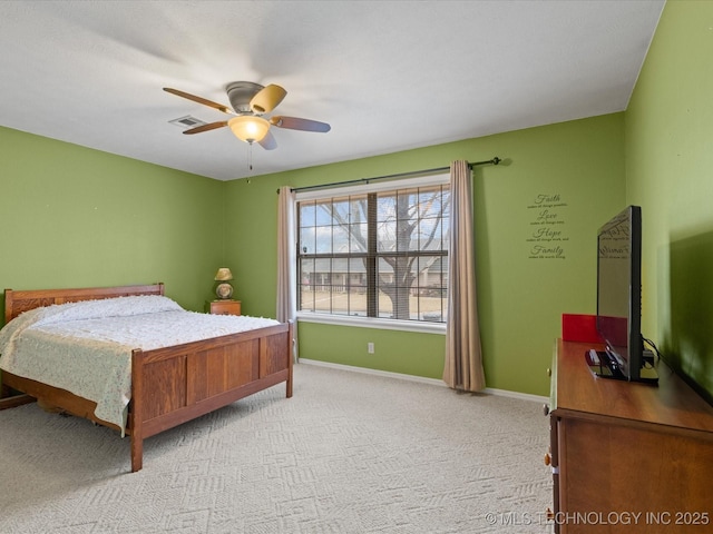 bedroom with light colored carpet and ceiling fan