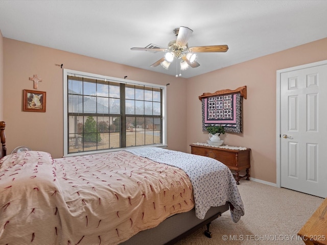 carpeted bedroom with ceiling fan