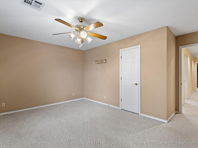 unfurnished room with light carpet and ceiling fan