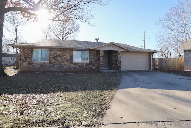 ranch-style home featuring a garage