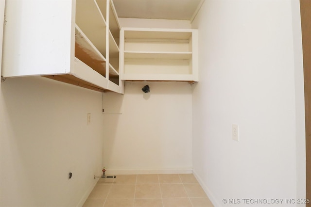 laundry room featuring light tile patterned floors