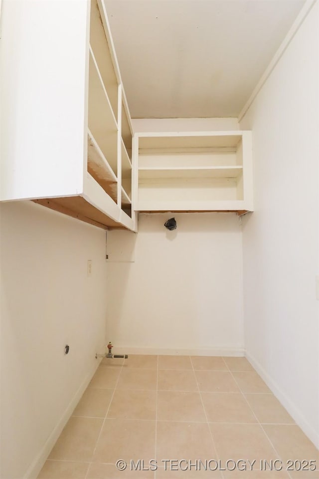 laundry area featuring tile patterned floors