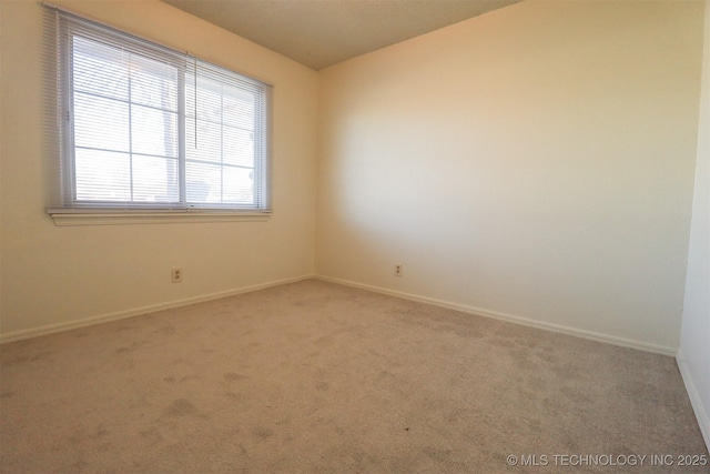 empty room with carpet flooring