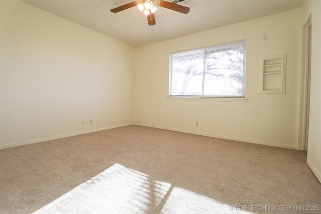 empty room with light carpet and ceiling fan