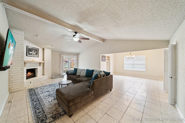 tiled living room featuring vaulted ceiling with beams, ceiling fan with notable chandelier, a fireplace, and a textured ceiling