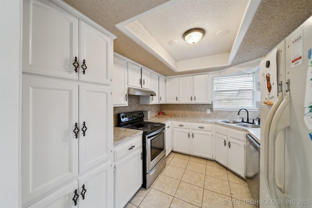 kitchen with white cabinetry, sink, a raised ceiling, and appliances with stainless steel finishes