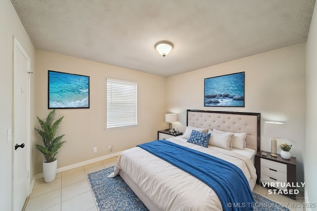 bedroom featuring light tile patterned floors