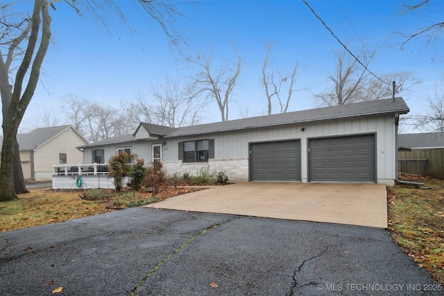 ranch-style house featuring a garage