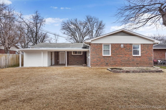 rear view of house with a lawn