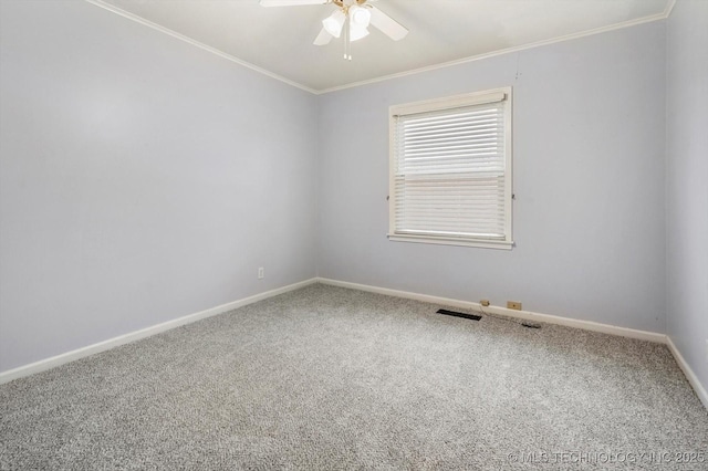 empty room featuring ornamental molding, ceiling fan, and carpet flooring