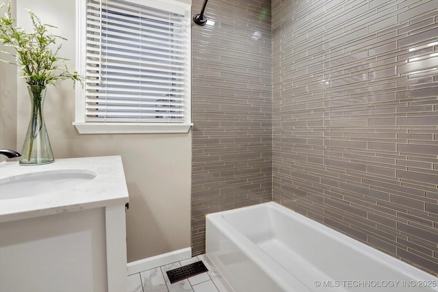 bathroom with vanity and tiled shower / bath combo