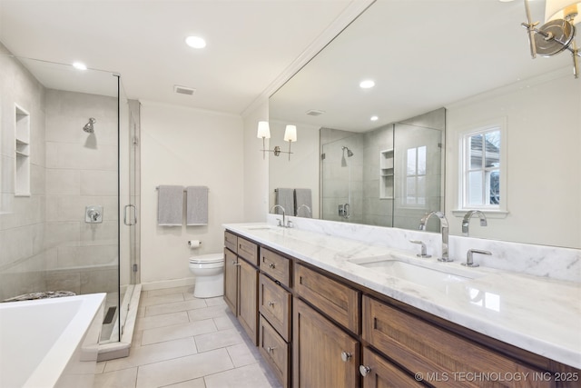 full bathroom featuring tile patterned floors, toilet, crown molding, vanity, and plus walk in shower