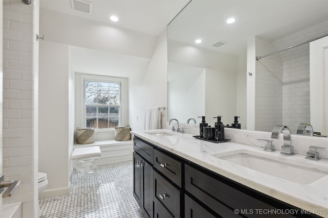 bathroom with vanity and toilet