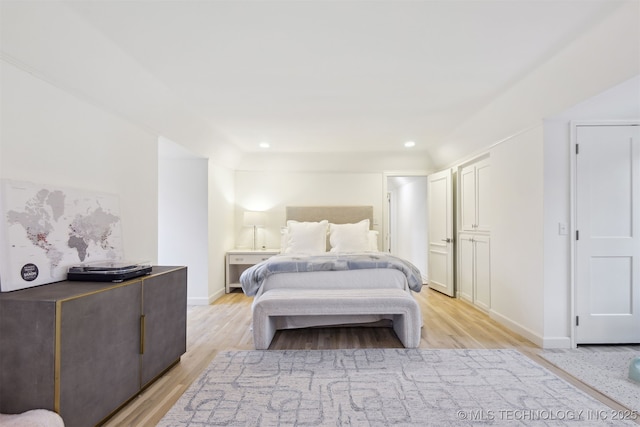 bedroom with light hardwood / wood-style flooring