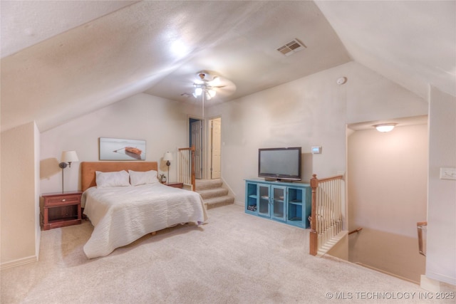 bedroom with carpet flooring and vaulted ceiling