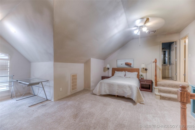 bedroom featuring lofted ceiling, light colored carpet, and ceiling fan