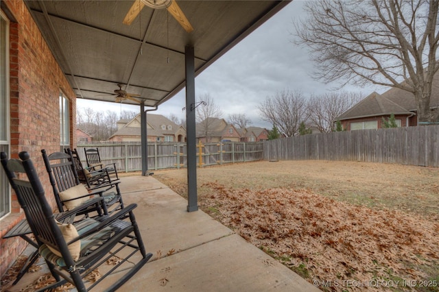 view of yard featuring a patio and ceiling fan