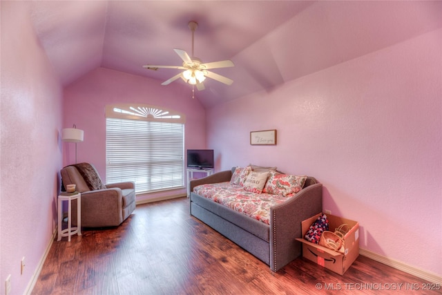 bedroom with vaulted ceiling, dark hardwood / wood-style floors, and ceiling fan