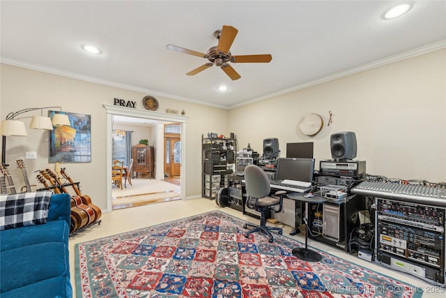 home office with crown molding, carpet floors, and ceiling fan