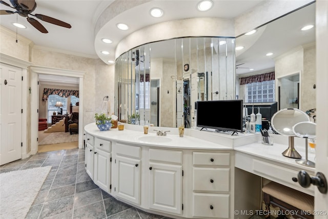 bathroom with a shower with door, ornamental molding, vanity, and ceiling fan