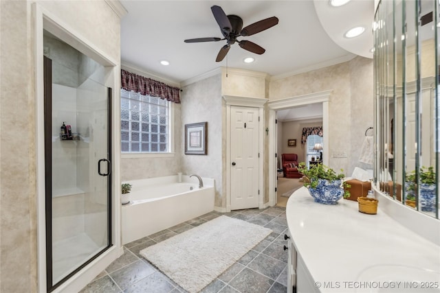 bathroom with vanity, crown molding, shower with separate bathtub, and ceiling fan