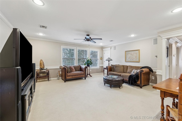 carpeted living room with ornamental molding and ceiling fan