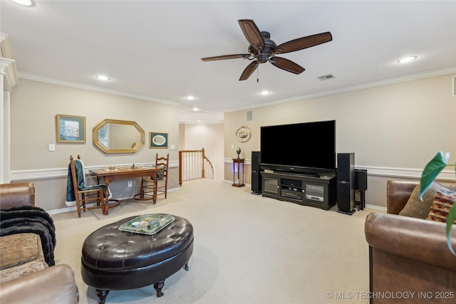 living room with crown molding, light colored carpet, and ceiling fan