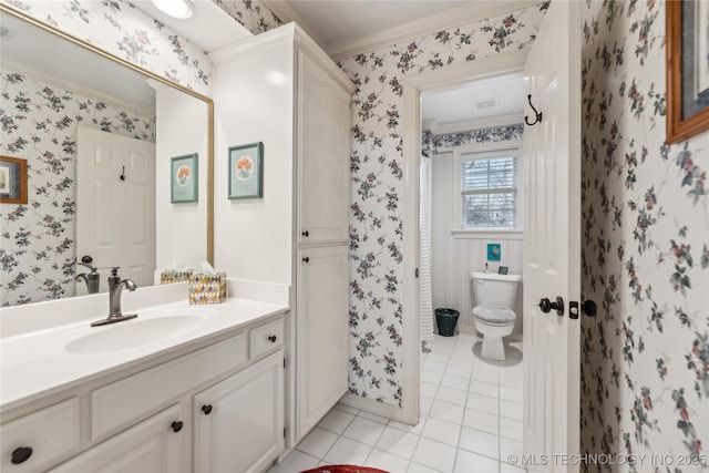 bathroom with vanity, crown molding, tile patterned floors, and toilet