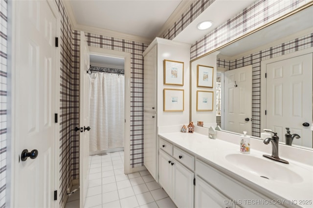 bathroom featuring crown molding, vanity, and tile patterned floors