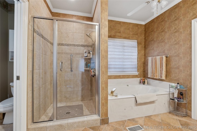 bathroom featuring ornamental molding, separate shower and tub, ceiling fan, and toilet