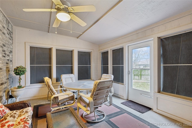 sunroom with lofted ceiling and ceiling fan