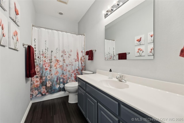 bathroom featuring a shower with curtain, vanity, wood-type flooring, and toilet