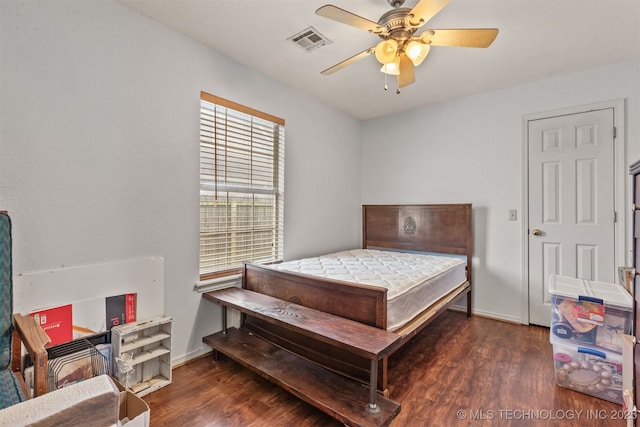 bedroom with ceiling fan and dark hardwood / wood-style flooring