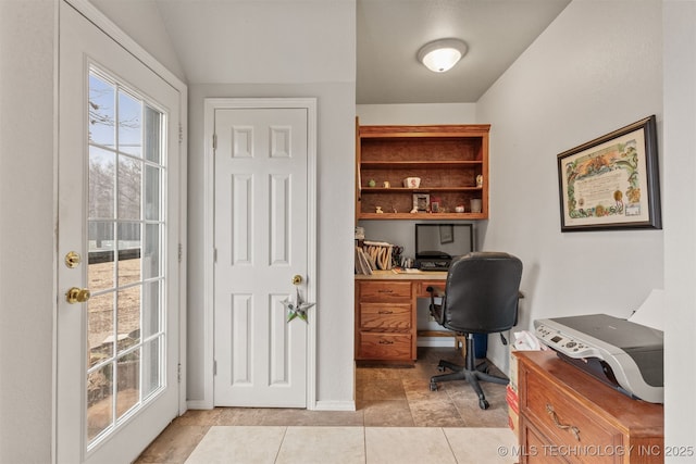 tiled office with vaulted ceiling