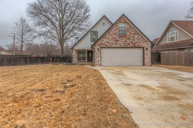 view of front of home featuring a garage and a front yard