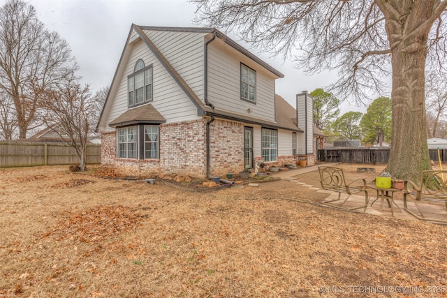 rear view of house with a patio