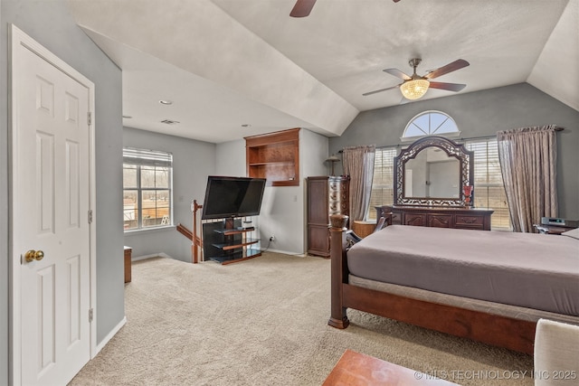 carpeted bedroom featuring ceiling fan and lofted ceiling