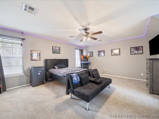 bedroom featuring ceiling fan and light colored carpet