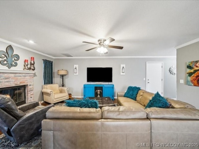 living room featuring ornamental molding, a brick fireplace, and ceiling fan