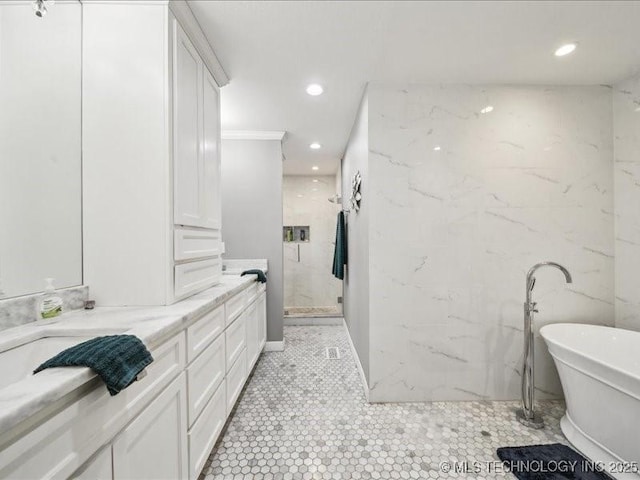 bathroom featuring vanity and shower with separate bathtub