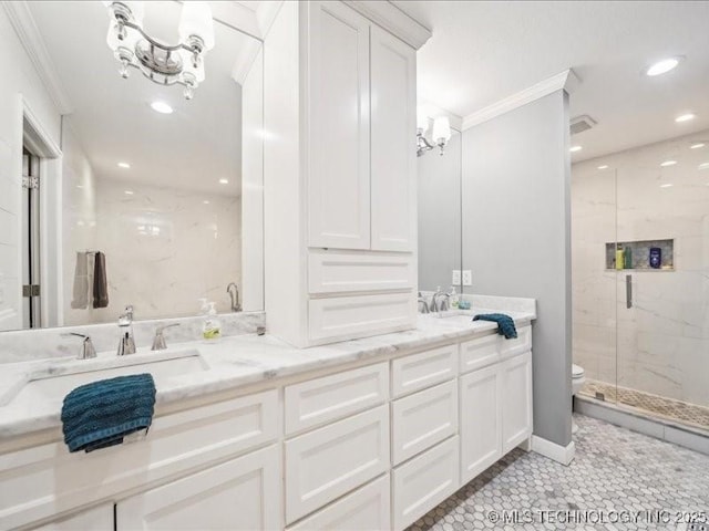 bathroom with crown molding, an enclosed shower, a chandelier, and vanity