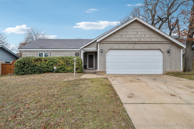 ranch-style house with a garage and a front lawn