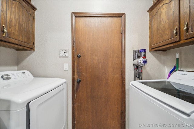 laundry area featuring cabinets and washer and dryer