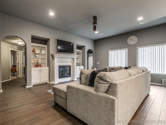 living room featuring built in features