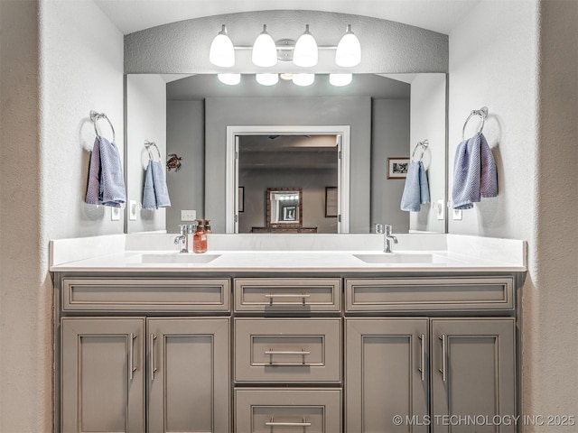 bathroom featuring vanity and lofted ceiling