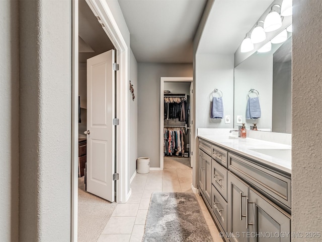 bathroom featuring tile patterned flooring and vanity