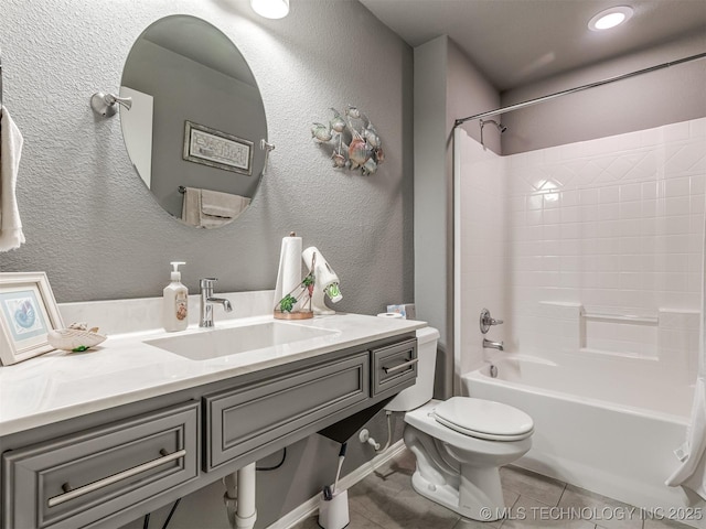 full bathroom with shower / bath combination, sink, tile patterned flooring, and toilet