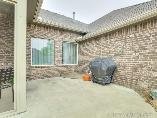 view of patio featuring a grill